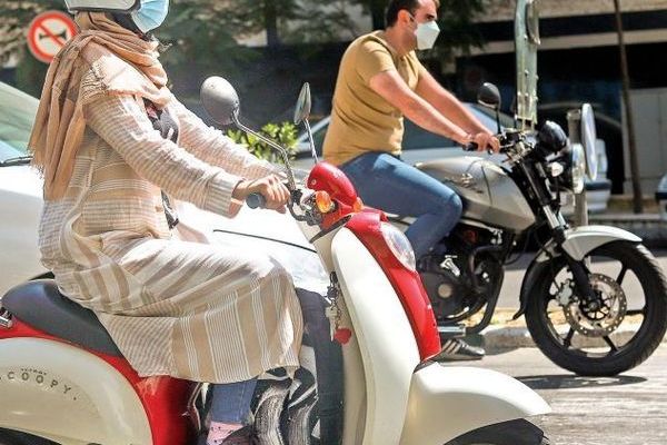 Iranian Police Detain Motorcyclists Offering Ride To Woman Without Hijab