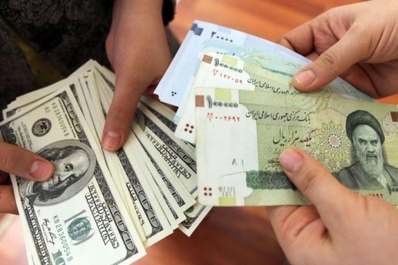 US dollars and Iranian rials at an exchange outlet in Tehran. Undated