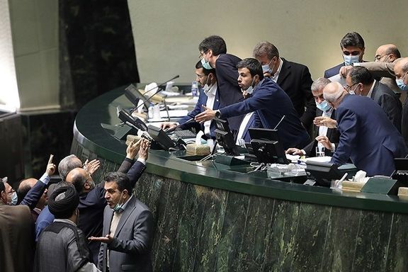 Conservatives mingling and horse trading in parliament, in January 2022