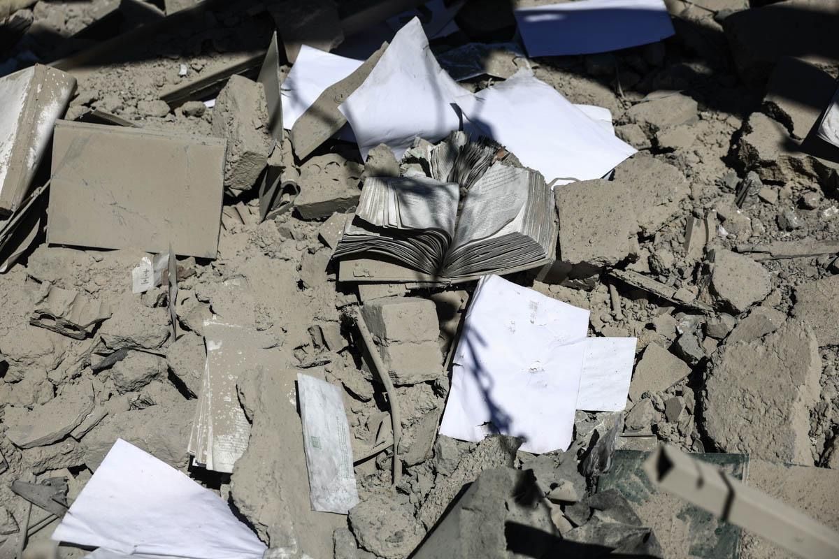 Books and papers lie scattered amidst the rubble of a building in Tehran's Sharif University of Technology, after a US-Israeli strike, April 7, 2026