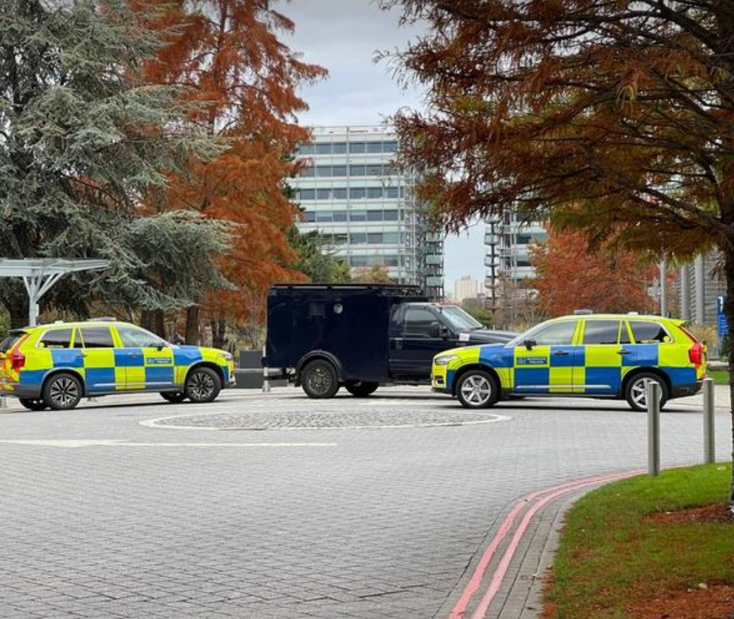 Armored police vehicles are seen outside the headquarters of Iran International in November 2022