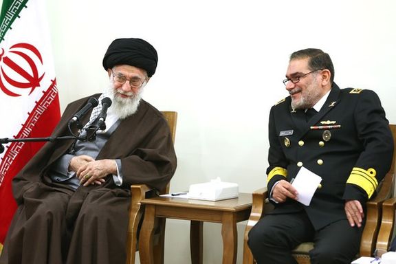Iran's former national security chief Ali Shamkhani sitting beside Supreme Leader Ali Khamenei
