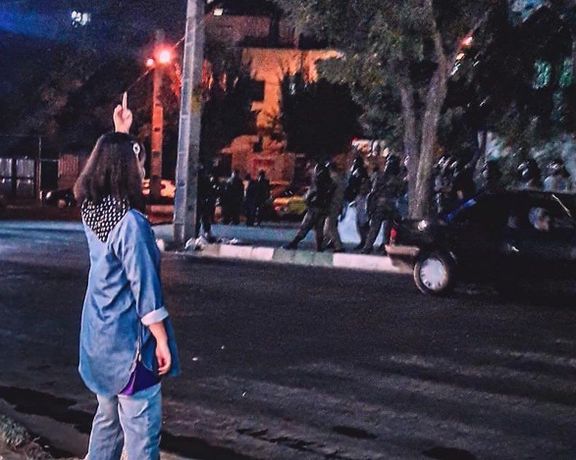 A girl without hijab during the ongoing protests in Iran