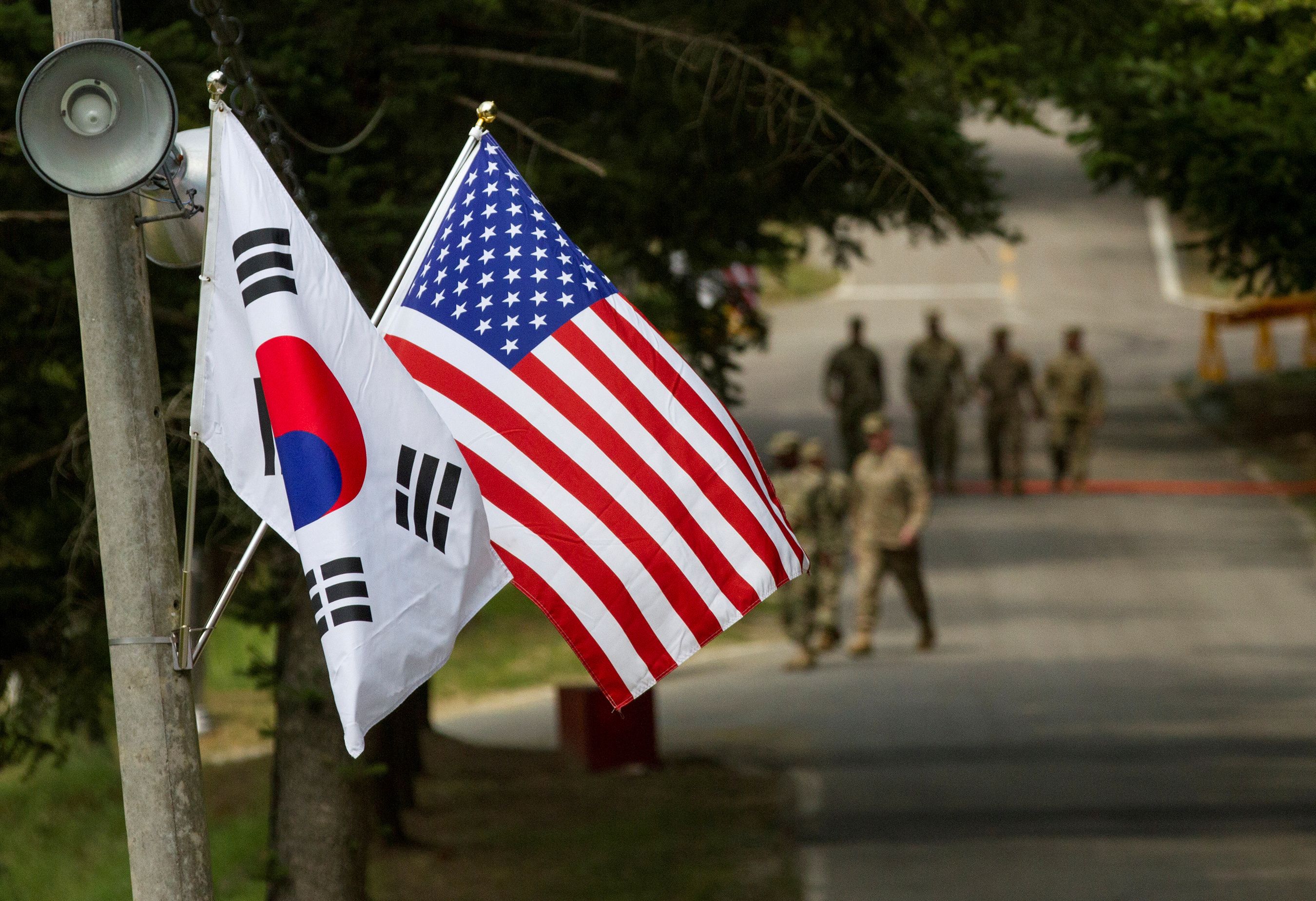 The South Korean and American flags fly next to each other at Yongin, South Korea, August 23, 2016. 