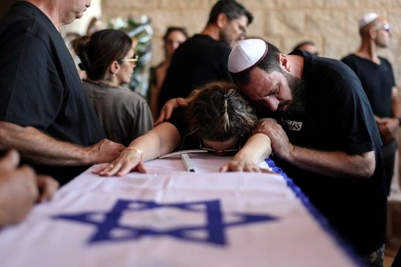 Relatives mourn Pessi Cohen, Hannah Sitton, Hannah's husband Itzhak Sitton, and their son Tal Sitton, who were killed in an attack by Hamas militants at Kibbutz Beeri, during their joint funeral in Hod Hasharon, Israel, October 18, 2023.