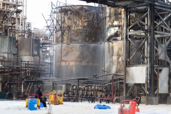 People work to put out a fire at an oil refinery in Bandar Abbas, Iran, July 10, 2023.