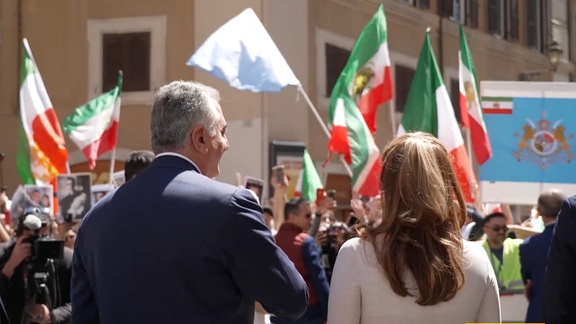 Iran’s exiled prince Reza Pahlavi (left) and his wife Yasmine speaking to their supporters outside the Italian parliament on April 26, 2023