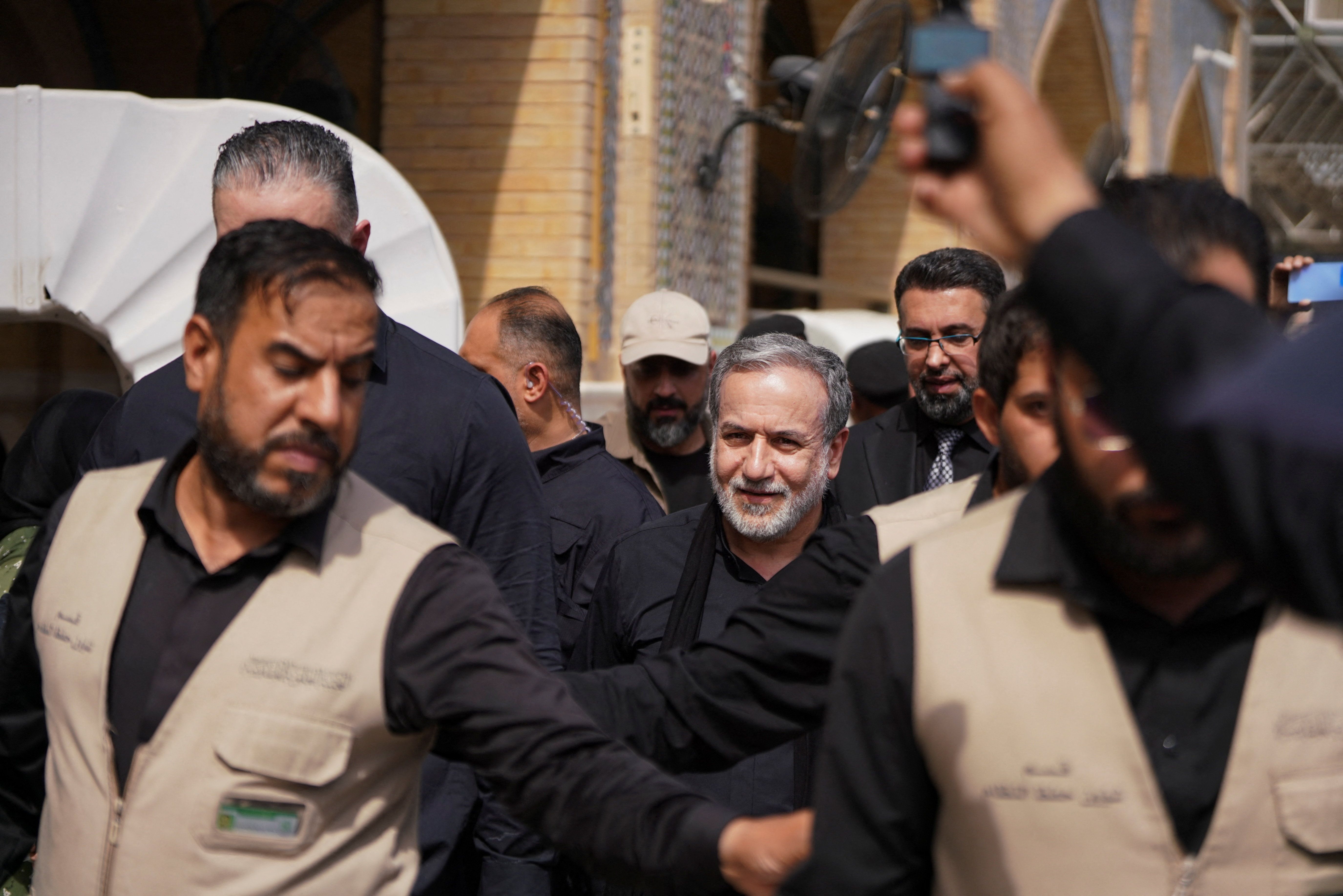 Iranian Foreign Minister Abbas Araghchi walks during a visit to Najaf in Iraq on August 3, 2026.