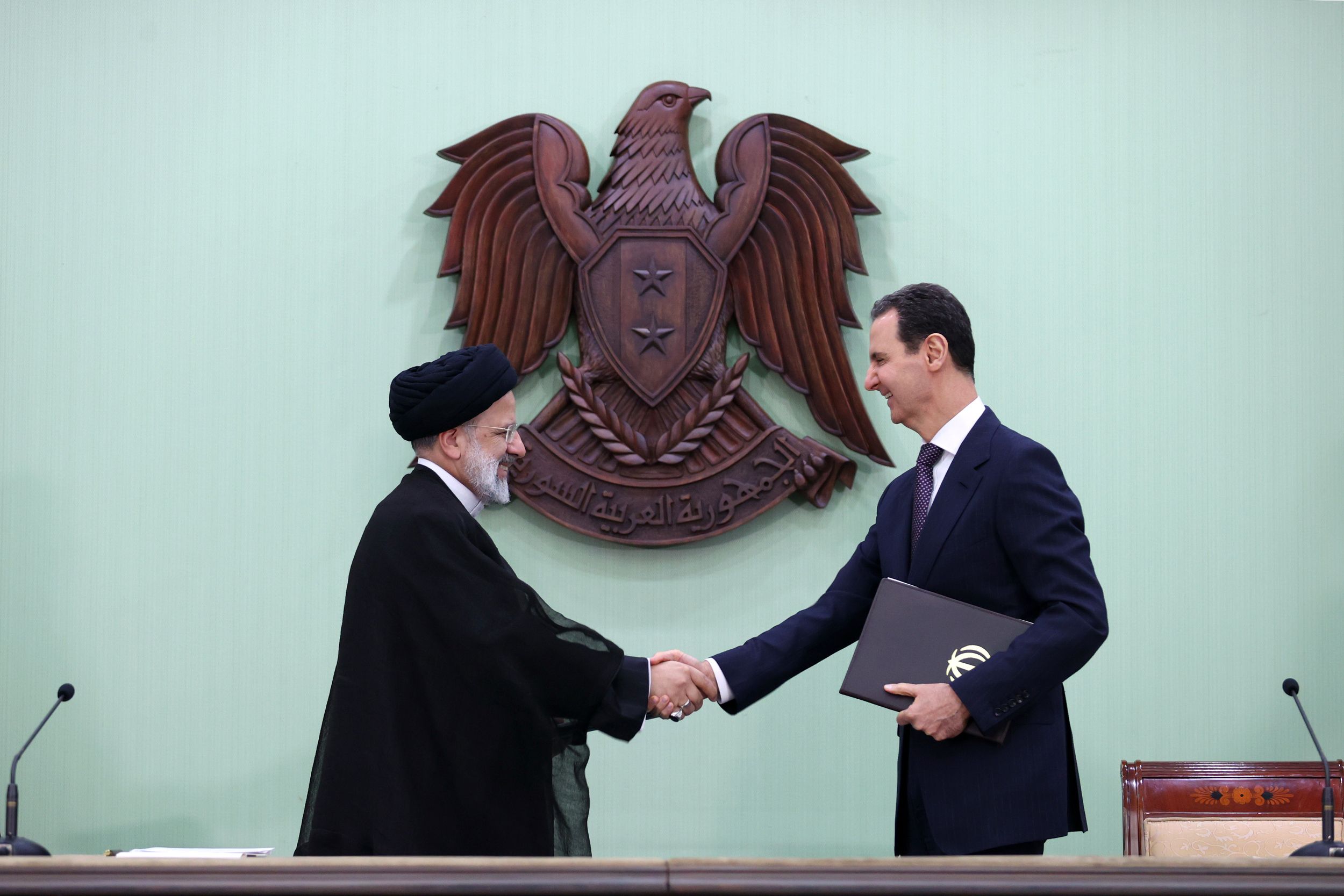 Iranian President Ebrahim Raisi (left) and Syrian President Bashar al-Assad during a meeting in Damascus on May 3, 2023 