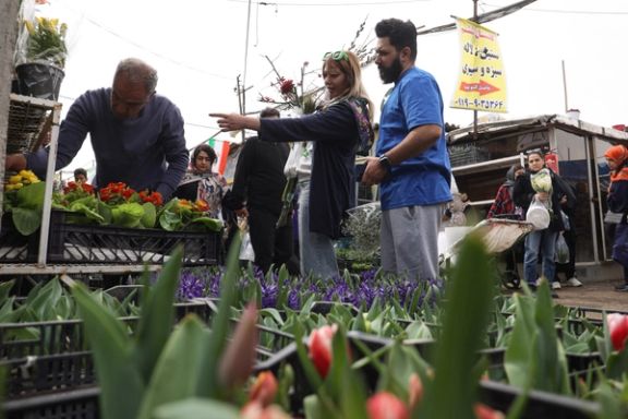 Iranian people shop at a flower market, ahead of Nowruz, the Iranian New Year, in Tehran, Iran March 17, 2024.
