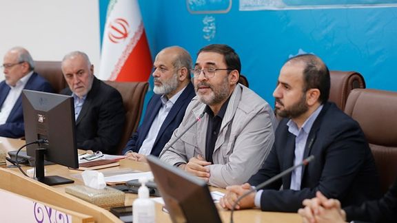 Interior Minister Ahmad Vahidi (center) and his political deputy Mohammad-Reza Gholamreza (2nd right) during a ministry session