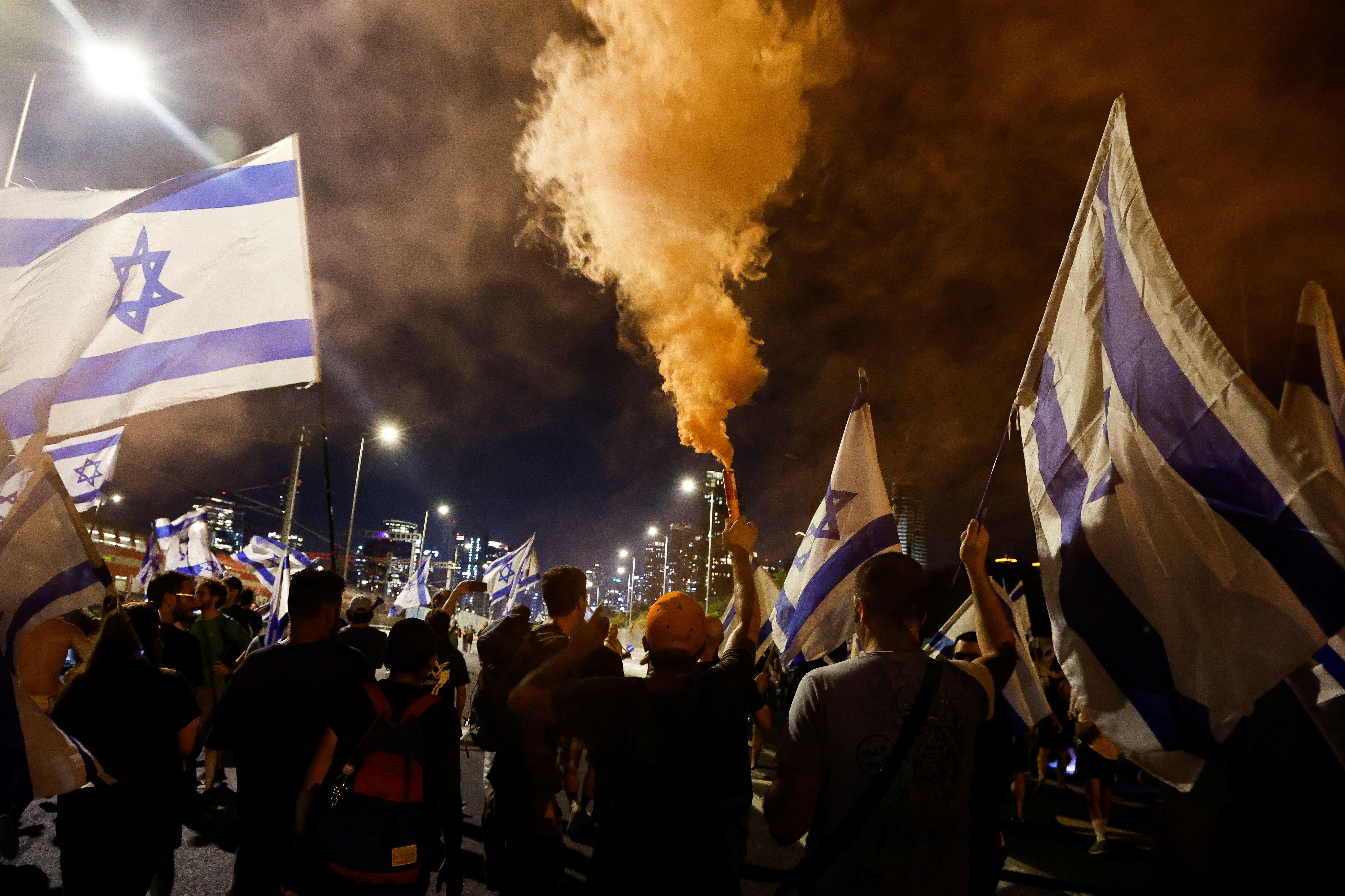 People demonstrate on the highway on the 'Day of National Resistance' in protest against Israeli Prime Minister Benjamin Netanyahu and his nationalist coalition government's judicial overhaul, in Tel Aviv, Israel July 18, 2023.