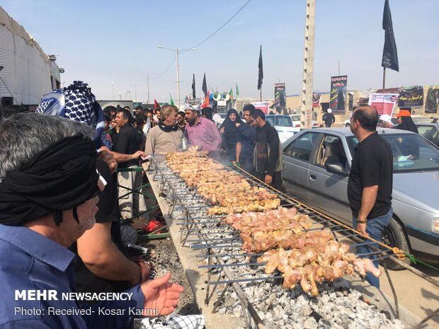 Free food is served to pilgrims of Arbaeen along the route to the Iraqi city of Karbala 