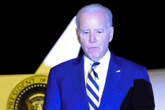 President Joe Biden looks on as he disembarks from Air Force One at Dover Air Force Base, October 20, 2023.