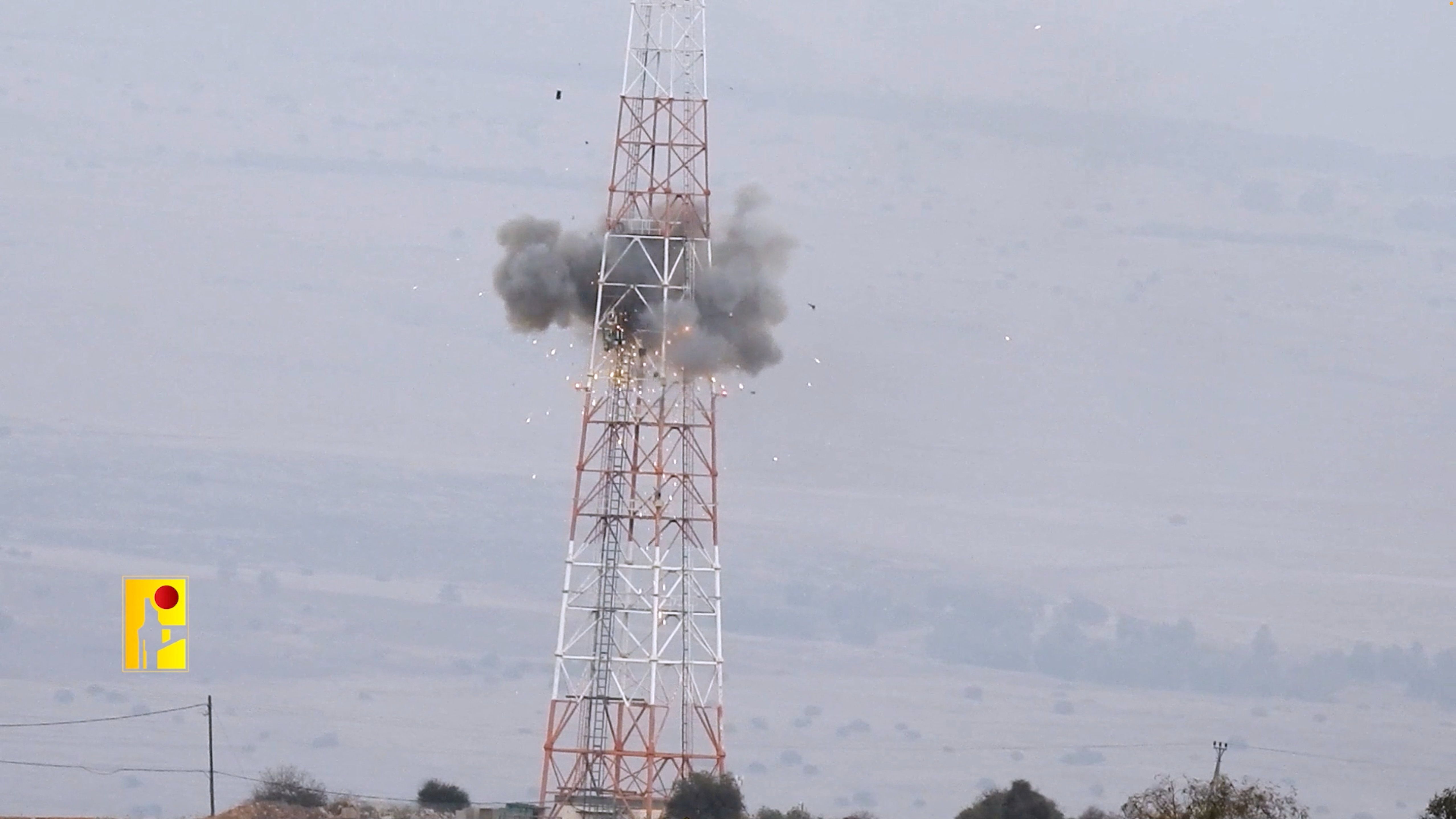 An explosion is seen on a tower that the Islamic Resistance said was at an Israeli military site near the Israel-Lebanon border in this screengrab obtained from a social media video by Reuters on October 19, 2023.