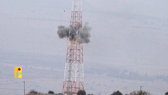 An explosion is seen on a tower that the Islamic Resistance said was at an Israeli military site near the Israel-Lebanon border in this screengrab obtained from a social media video by Reuters on October 19, 2023.