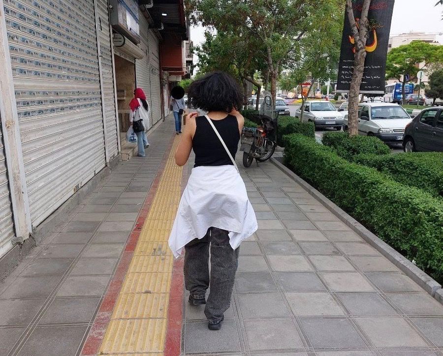 A girl on a street in the religious city of Mashhad