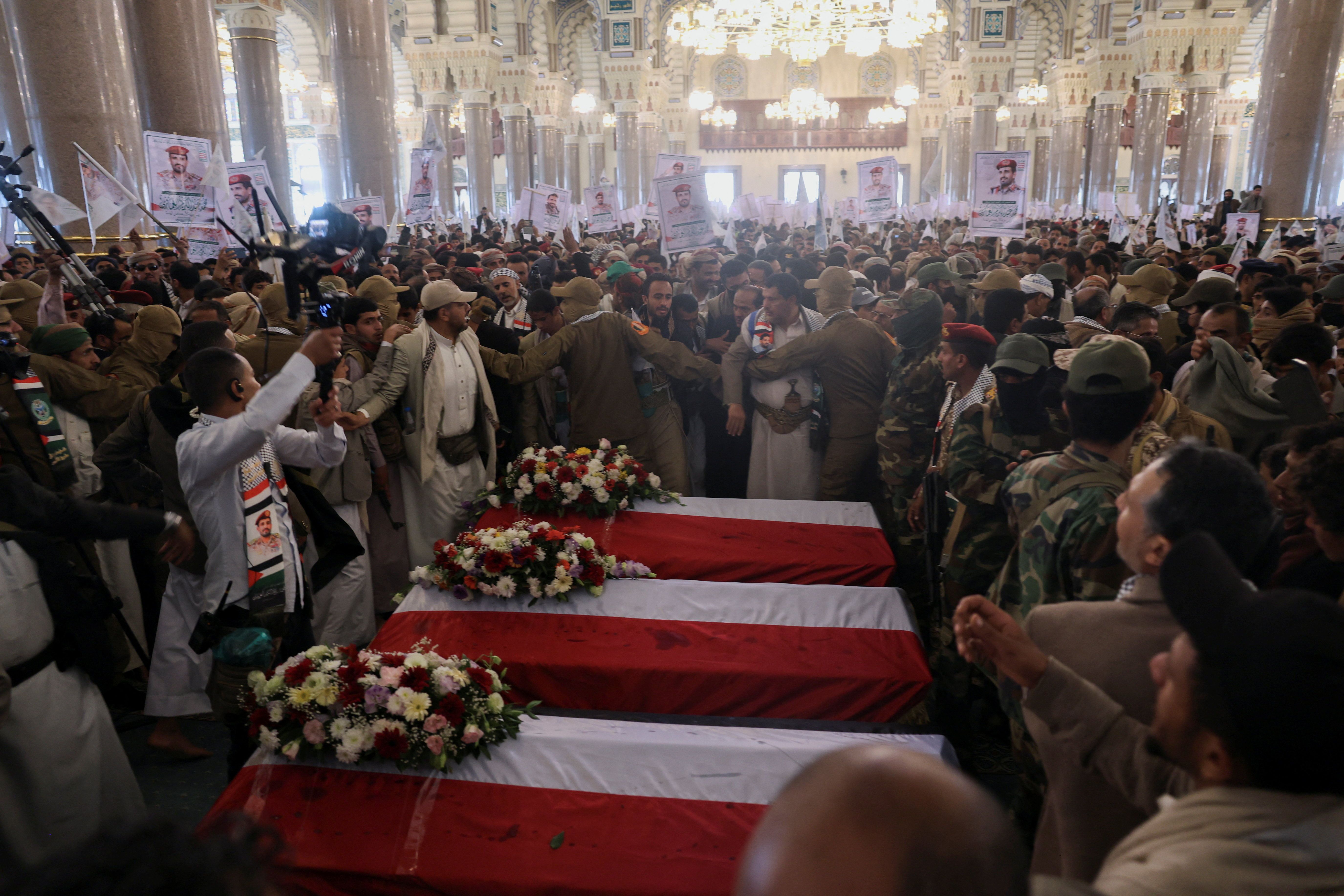 Mourners gather around the coffins on the day of a funeral procession of Houthi Chief of Staff Muhammad al-Ghamari, his son, Hussein, 13, and two bodyguards, four days after the group announced al-Ghamari's death, in Sanaa, Yemen, October 20, 2025.