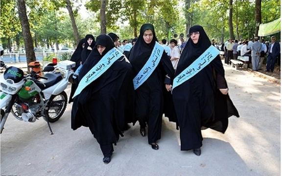 Women in a hijab enforcement patrol tasked with "advising" women to cover their heads