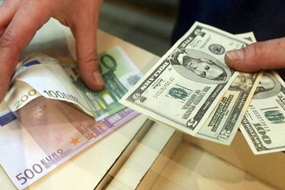 Dollar and euro banknotes at a currency exchange bureau in Tehran