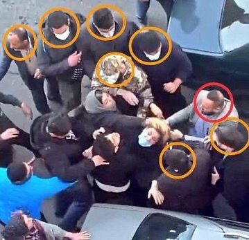 Plainclothes agents during the arrest of a mother whose daughter was poisoned in attacks on girls’ schools  