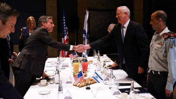 Israeli Defence Minister Benny Gantz shakes hands with US Secretary of State Antony Blinken during a diplomatic meeting on Sunday.