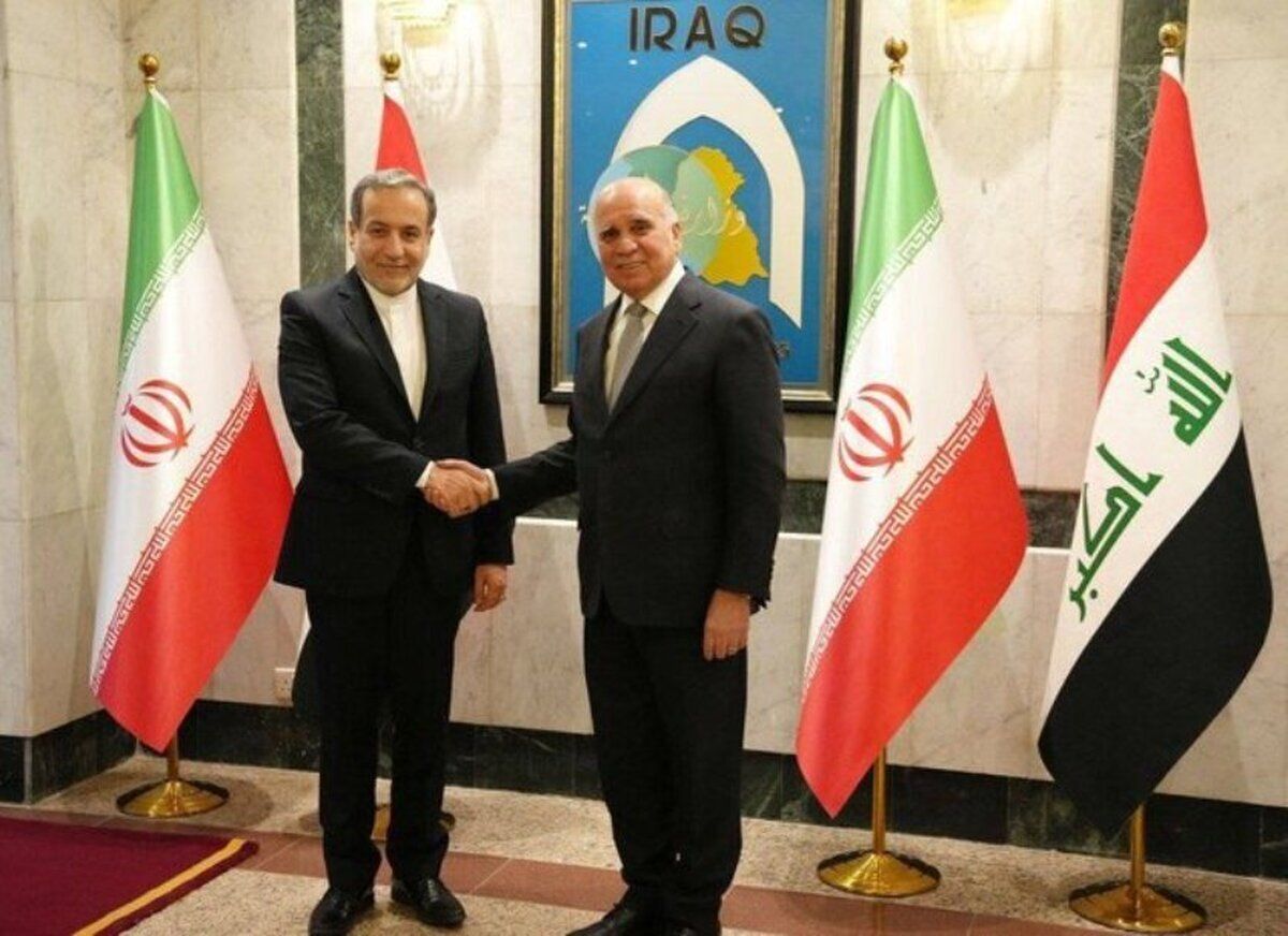 Iran's Foreign Minister Abbas Araghchi (left) and his Iraqi counterpart Fuad Hussein at Iraq’s Foreign Ministry’s headquarters in Baghdad, October 13, 2024 