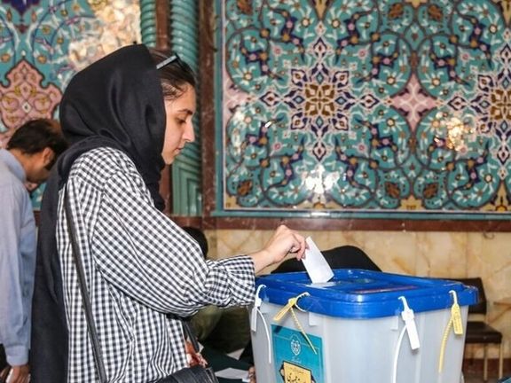 Young woman casts ballot for presidential election on June 28, 2024, in Tehran