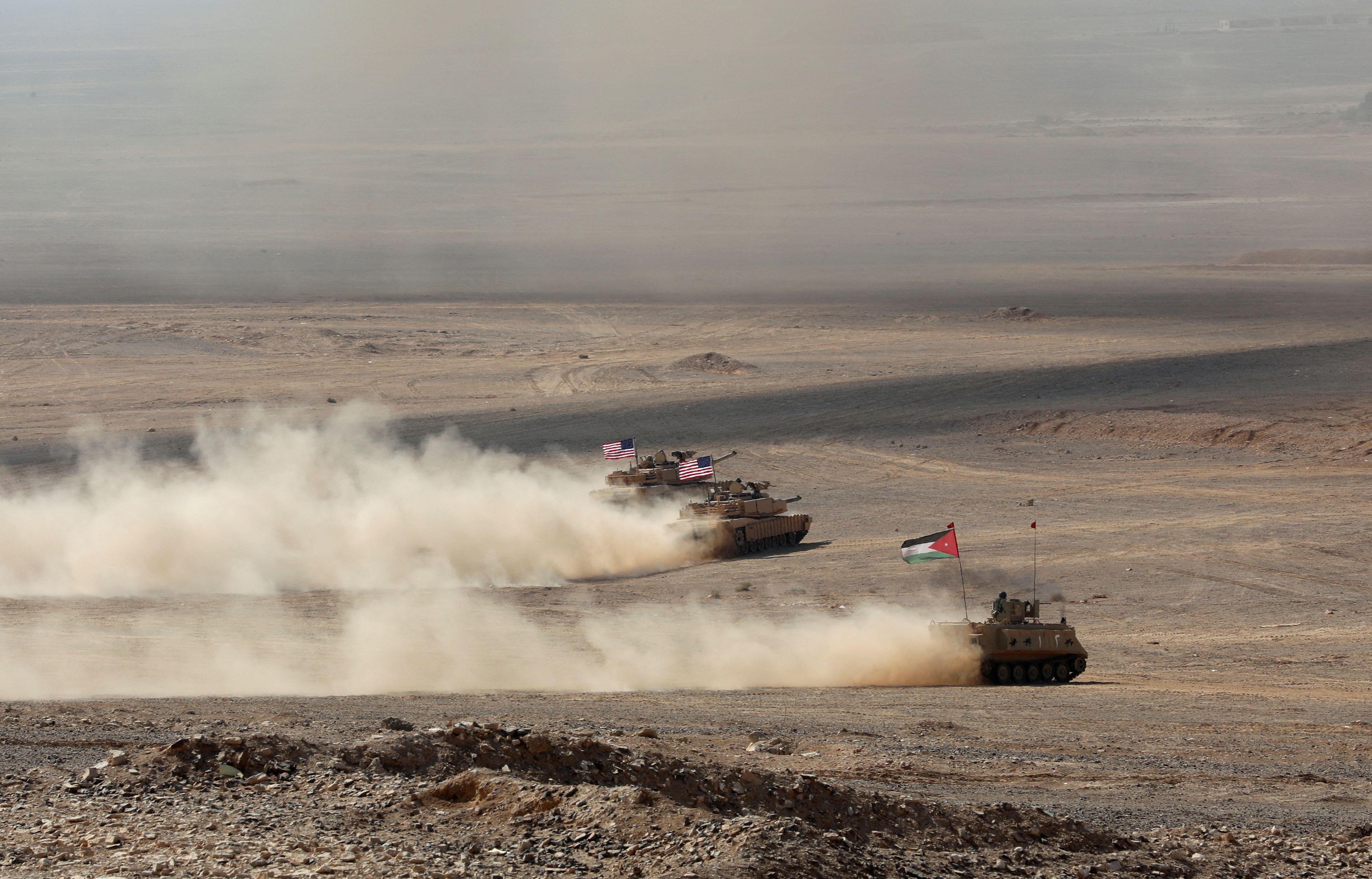 Military vehicles with Jordanian and US flags drive as part of the 'Eager Lion' military exercises, in Zarqa, Jordan September 14, 2022.