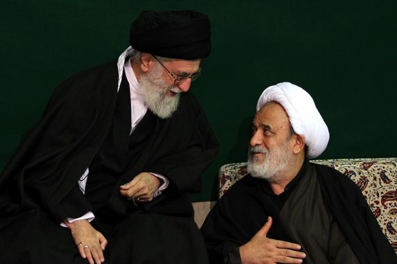 Iranian cleric Hossein Ansarian (right) and Supreme Leader Ali Khamenei