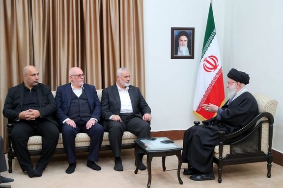 Hamas leader Ismail Haniyeh (3rd left) and Iran’s ruler Ali Khamenei (right) during a meeting in Tehran on March 26, 2024