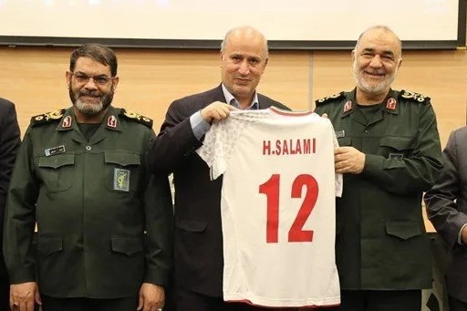Iranian football chief Mehdi Taj (centre) presents a national team jersey to now-slain IRGC chief Hossein Salami, undated file photo