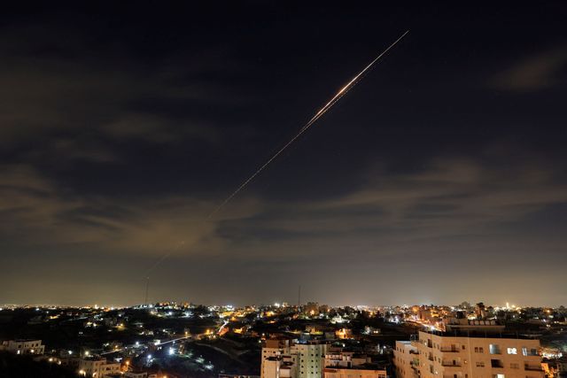 Iranian missiles fly towards Israel, amid the U.S.-Israeli conflict with Iran, as seen from Hebron, in the Israeli-occupied West Bank, March 23, 2026. 