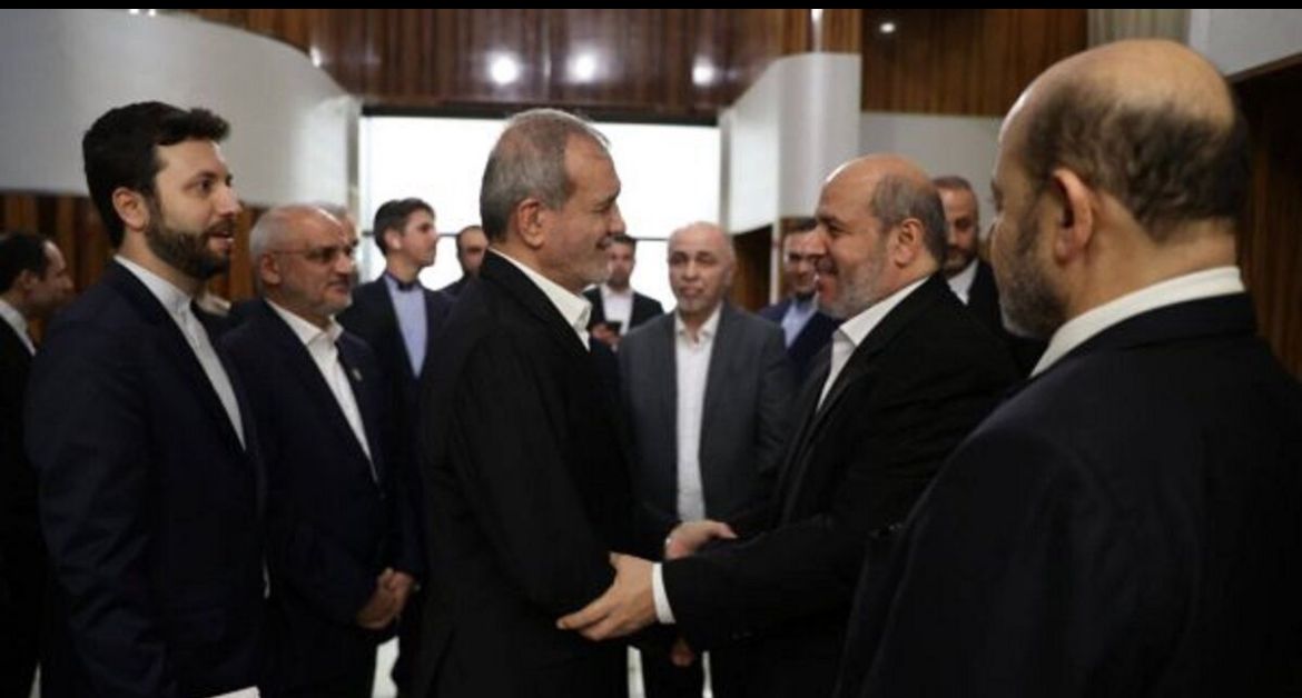 Iran’s President Masoud Pezeshkian  (left) meeting Hamas officials in Doha on October 2, 2024.