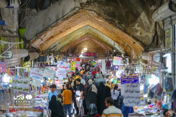 Iranians shopping in a bazaar in western city of Hamedan