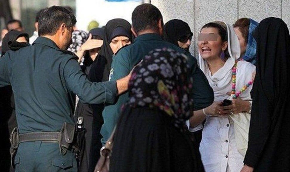 Hijab patrols confronting a woman  