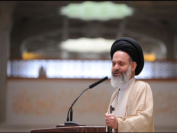 Ayatollah Hashemi Bushehri, holding a gun during a Friday sermon, as is customary for Islamic Republic.