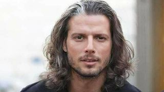 Tehran Police Warn Long-Haired Male Football Coach Over His Hijab