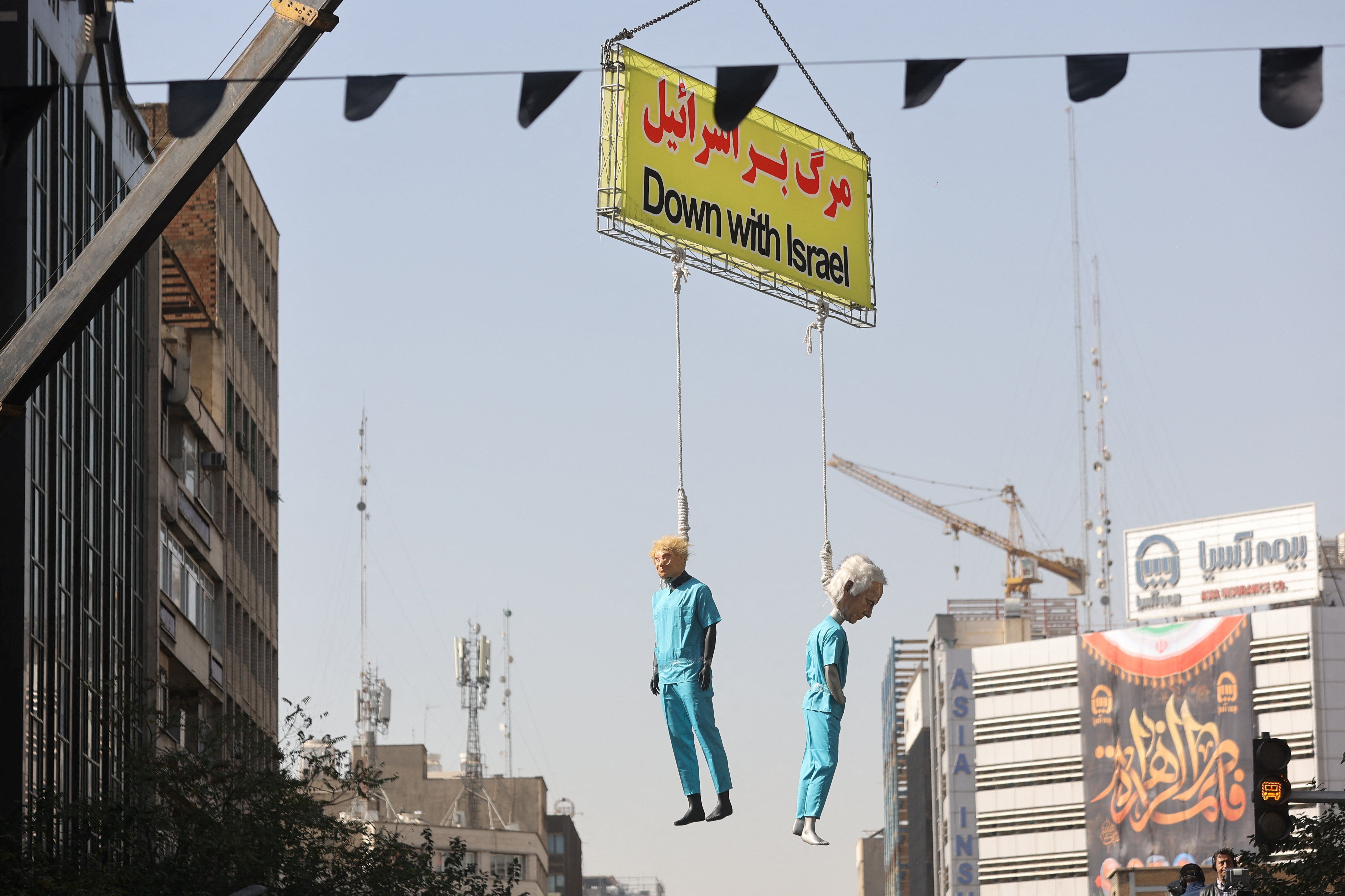 Effigies of US President Donald Trump and Israeli Prime Minister Benjamin Netanyahu being hanged are displayed during the 46th anniversary of the US expulsion from Iran, in Tehran, November 4, 2025. 