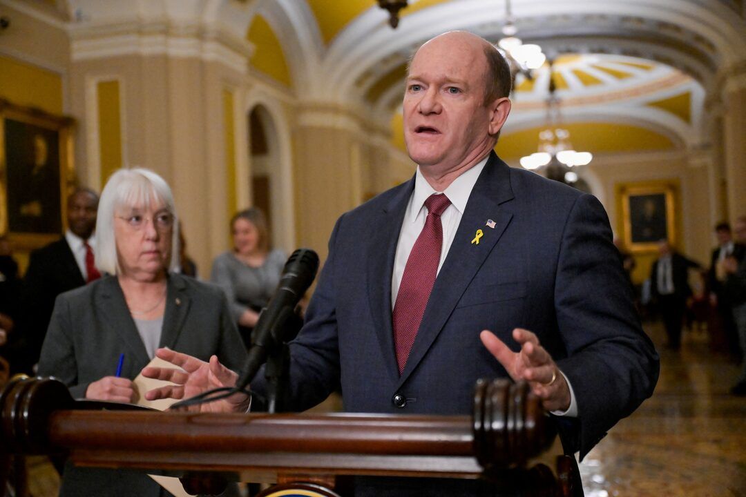 U.S. Senator Chris Coons (D-DE) speaks during a press conference following the weekly Senate caucus luncheons on Capitol Hill in Washington, March 12, 2024.