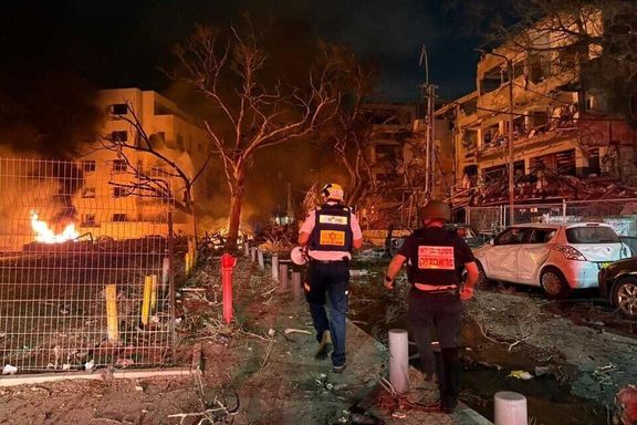 Magen David Adom paramedics attend to the site of an Iranian missile attack in central Israel, June 16, 2025.