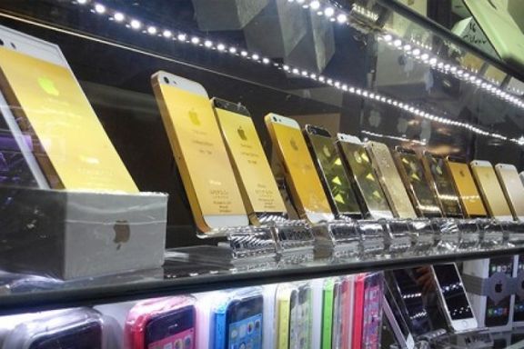 Apple iPhones on display on shelves in Tehran.