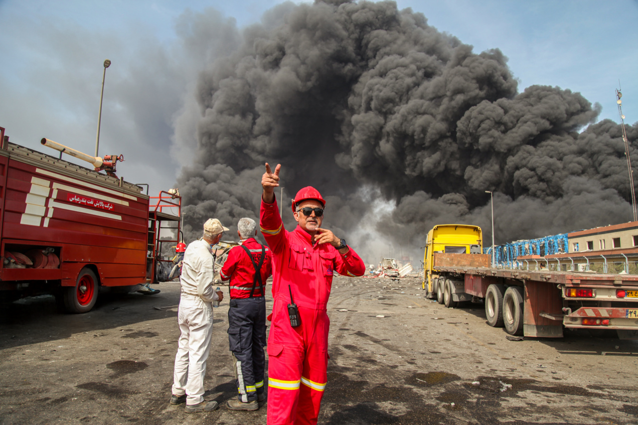 Firefighters work at the scene following an explosion at Shahid Rajaei Port in Bandar Abbas, Iran.