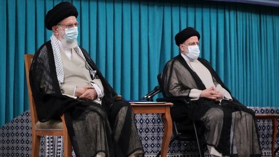 Iran’s ruler Ali Khamenei (L) and President Ebrahim Raisi during his inauguration