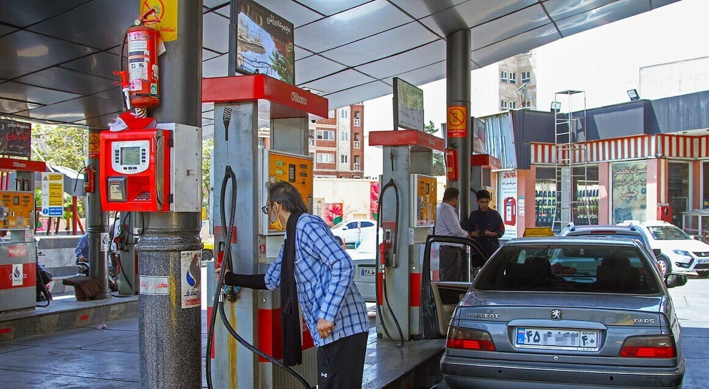 Drivers refuel vehicles at a gas station in Iran