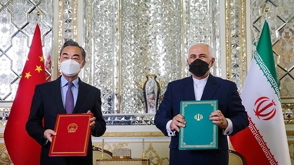 Chinese and Iranian foreign ministers showing 25-year cooperation agreement. Undated