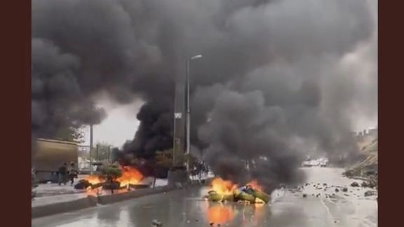 Protesters block roads in the Kurdish city of Sanandaj as security forces advance on Nov. 17, 2022