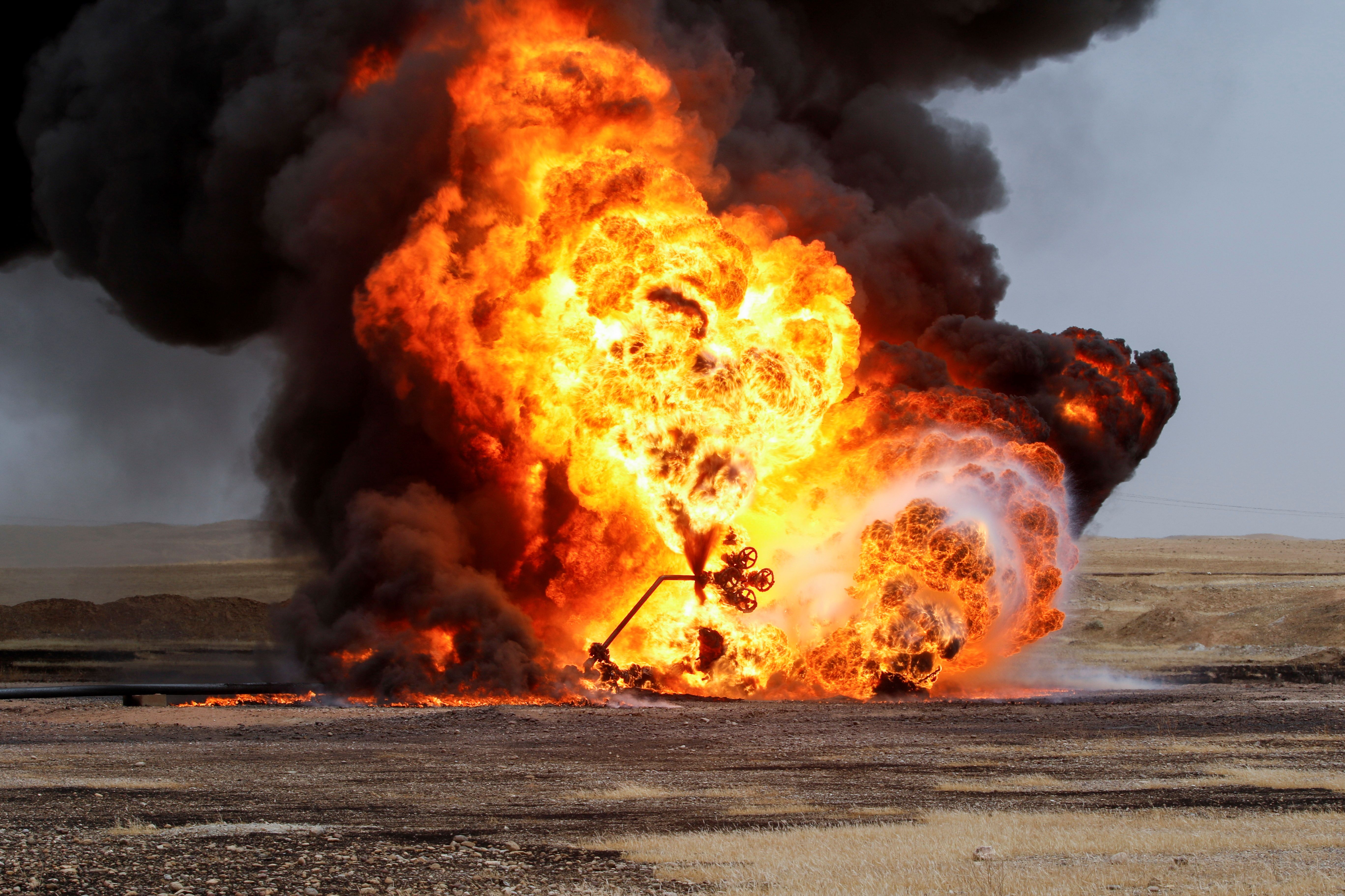 Flames and smoke rise from oil wells inside the Bai Hassan oilfield, which was attacked by militants, close to the northern Iraqi city of Kirkuk, Iraq, May 5, 2021.