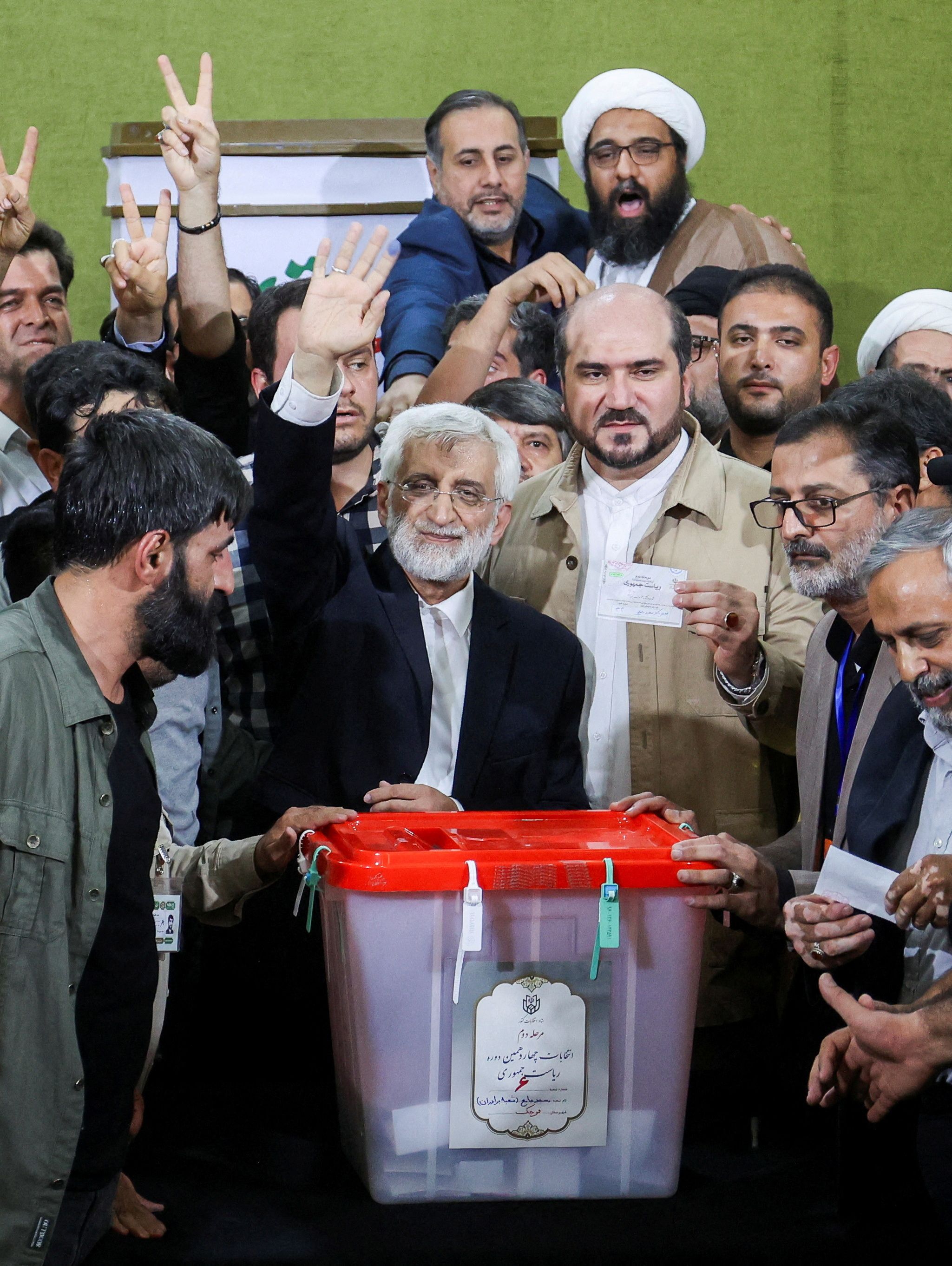 Saeed Jalili waves at the crowd during the run-off presidential election between him and Masoud Pezeshkian, in Tehran, Iran, July 5, 2024