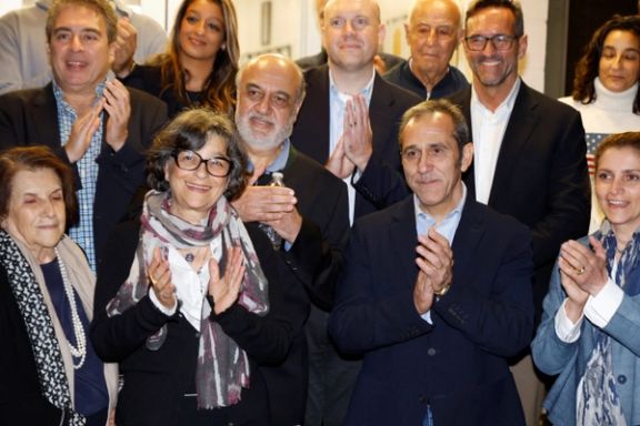 US officials arrange a group photo after freed Iranian-Americans Siamak Namazi, Morad Tahbaz, Emad Shargi, Reza Behrouzi and Fakhr al-Sadat Moeini arrived at Davison Army Airfield at Fort Belvoir, Virginia, September 19, 2023.
